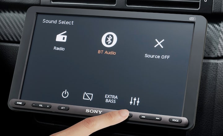 Image of the 22.7cm (8.95") DAB Media Receiver with WebLink Cast inside a car with a driver using the easy to use display.
