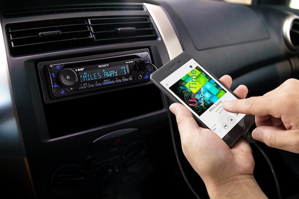 A passenger using a smartphone with the MEX-N7300BD